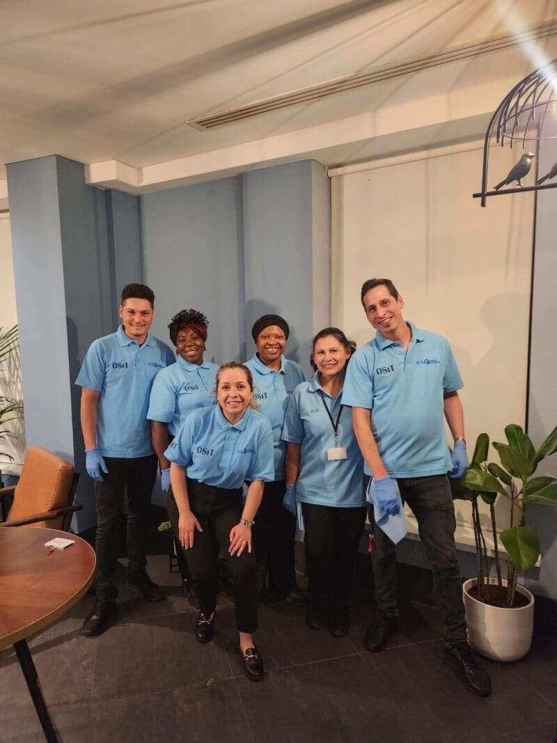 A group photo of the OSCL cleaning professionals, representing our commitment to reliable, high quality commercial cleaning and sanitization services for boutique workspaces.