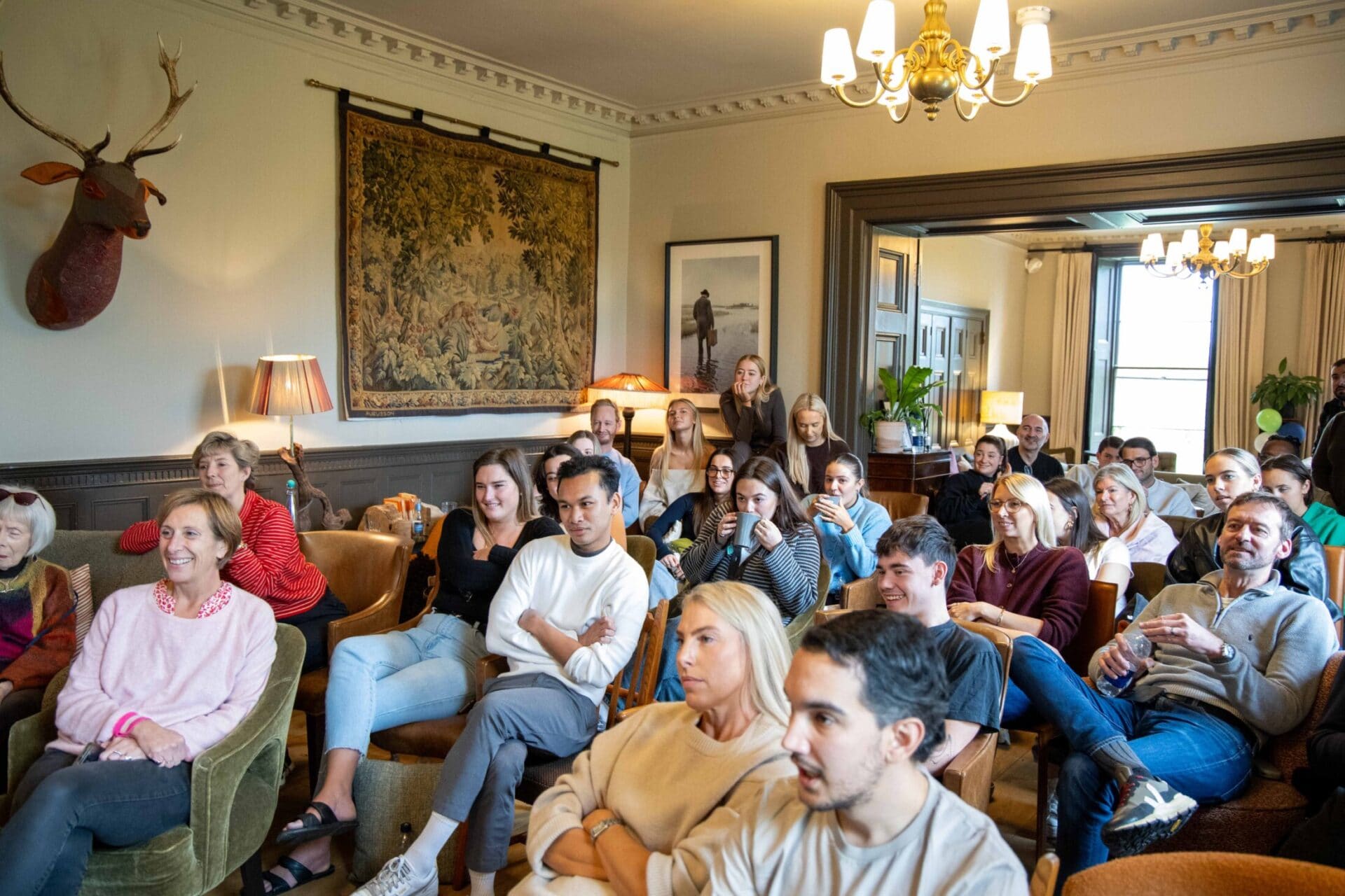 A large group photo of the OSiTeers during the annual Office Space in Town weekend away, celebrating the strong team culture and family values that drive our boutique office success.