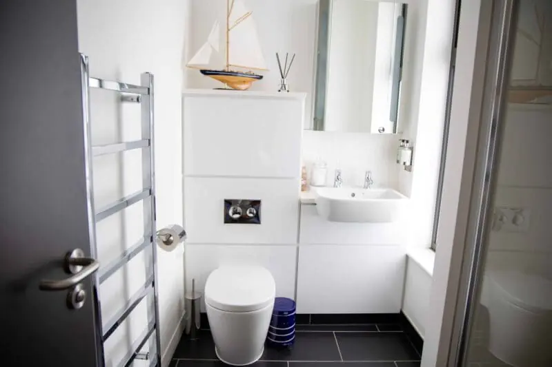 Premium amenities at The Cabins by Office Space in Town, showcasing the smart storage, plush linens, and integrated technology provided for business travelers staying in the Hesperus bedroom.