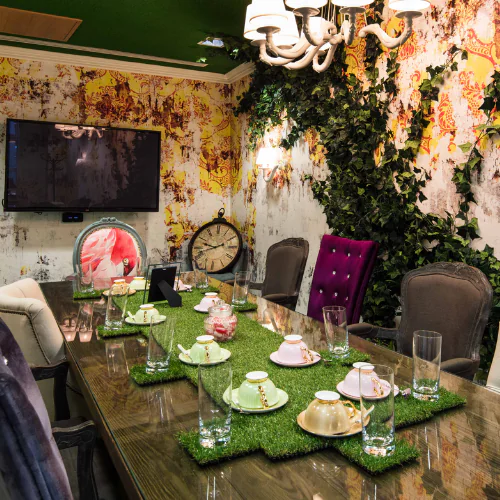 The whimsical Mad Hatter meeting room at Office Space in Town Waterloo, featuring unique Alice in Wonderland inspired boutique decor, vibrant colors, and bespoke creative furniture at 2-6 Boundary Row, SE1.