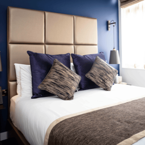 Premium overnight accommodation for tenants at Office Space in Town Monument, showcasing a sophisticated serviced bedroom with a luxury yacht-inspired design in the heart of the City.