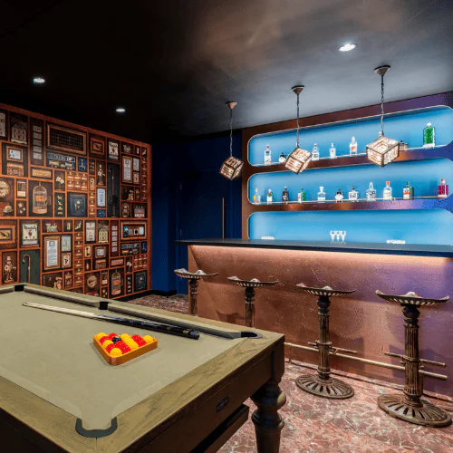 A unique and creative boardroom at Office Space in Town Liverpool Street, showcasing the Mr M’s Cabinet of Curiosities themed suite equipped with high-spec technology for inspiring business meetings.