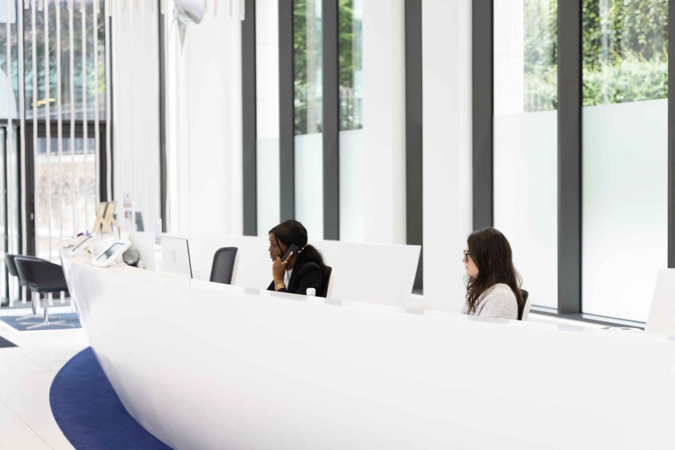 Friendly and professional front-of-house staff at Office Space in Town Monument, showcasing the personalized concierge-style service available to office tenants in EC3R.