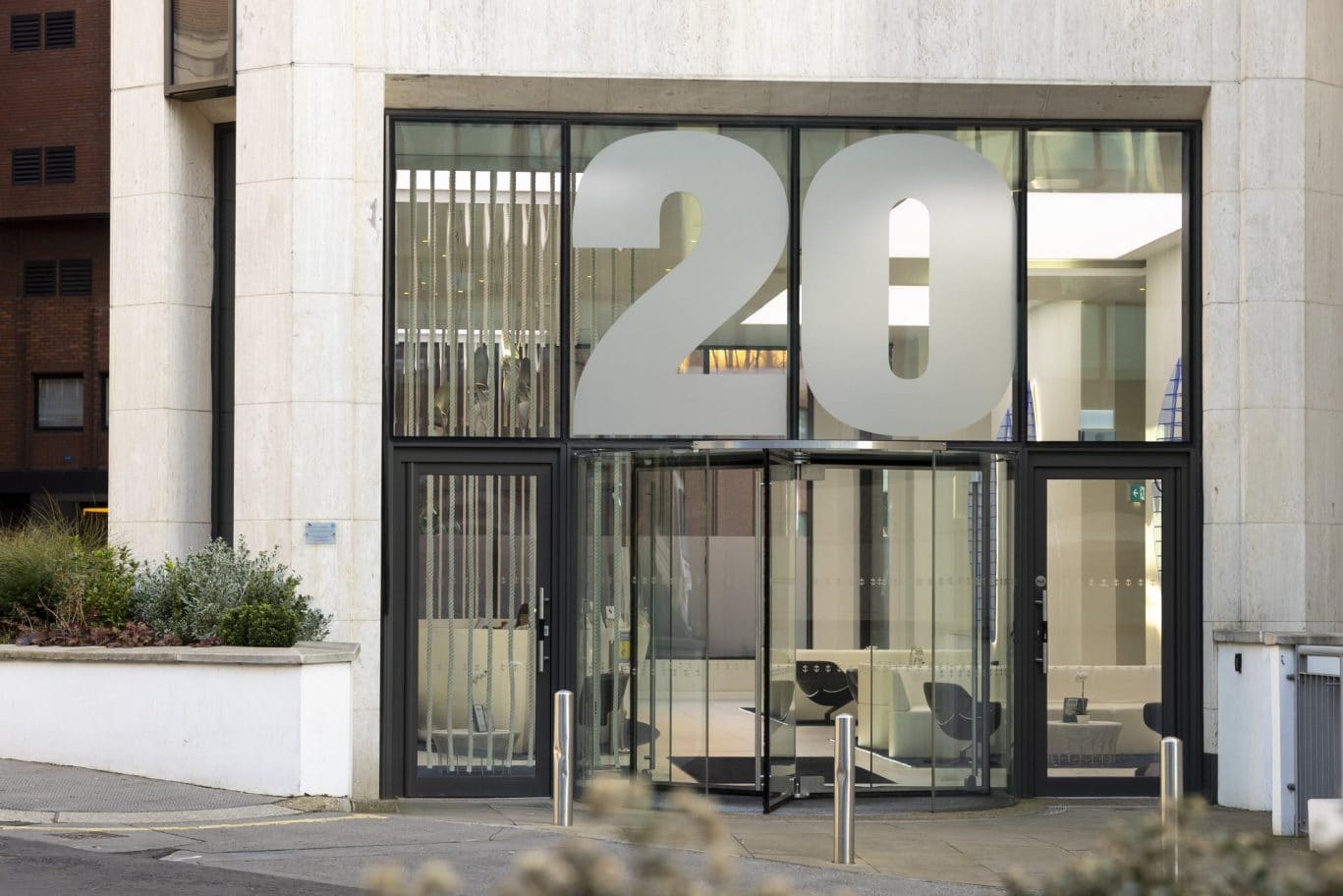 Luxury serviced office entrance in London EC3R, highlighting the prestigious OSiT Monument building frontage for corporate professionals near Monument Station.