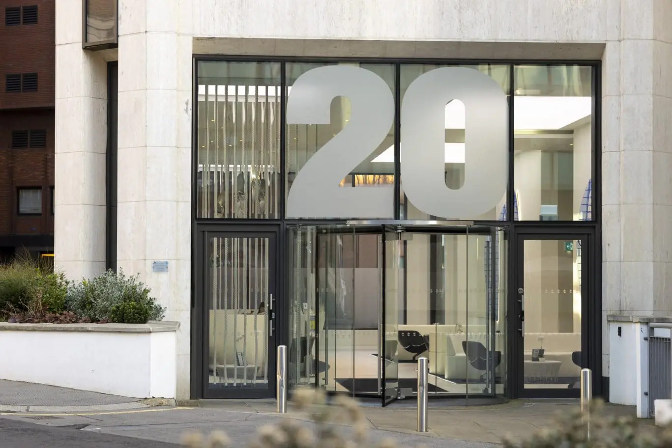 Luxury serviced office entrance in London EC3R, highlighting the prestigious OSiT Monument building frontage for corporate professionals near Monument Station.