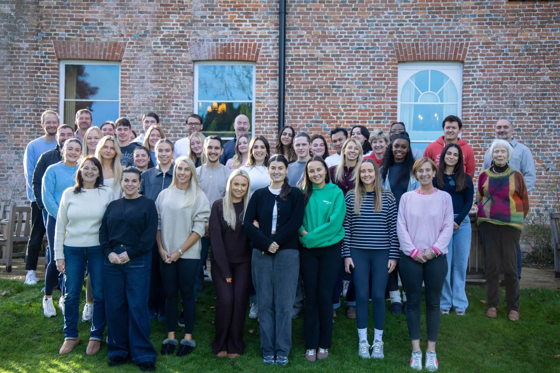 A group photo of the Office Space in Town team, known as the OSiTeers, representing the professional and friendly support staff at our award winning boutique serviced offices in London and the UK.