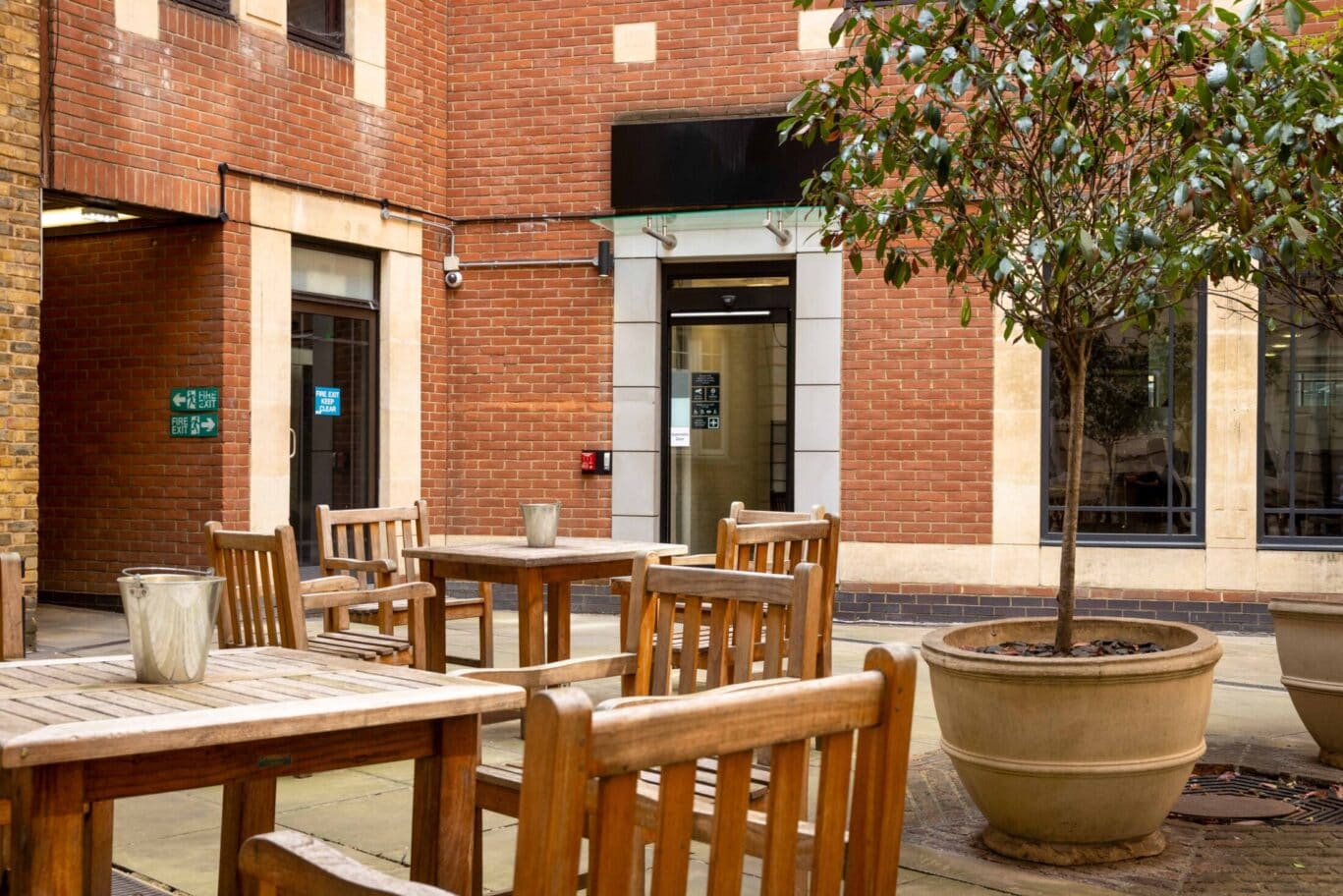 Luxury serviced office with outdoor space in St Paul's, highlighting the stylish courtyard at OSiT 20 Little Britain for corporate clients and professional events.